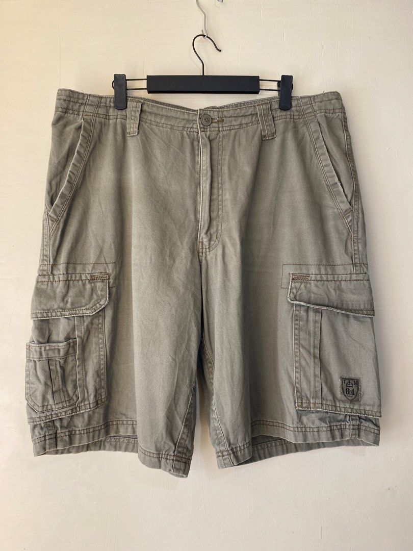 COMPANY 81,Cargo shorts (Category: Shorts) located in Cavite. Submitted by jc_thrift95 (Listing ID 1466494085, Image 1). Description: - a pair of khaki or olive-green cotton cargo shorts featuring side flap pockets and a small logo patch on the lower left pocket. - Made in Bangladesh - L- 22 inch - W- 19 inch - Color rate 8/10 - See pictures details for dimes..