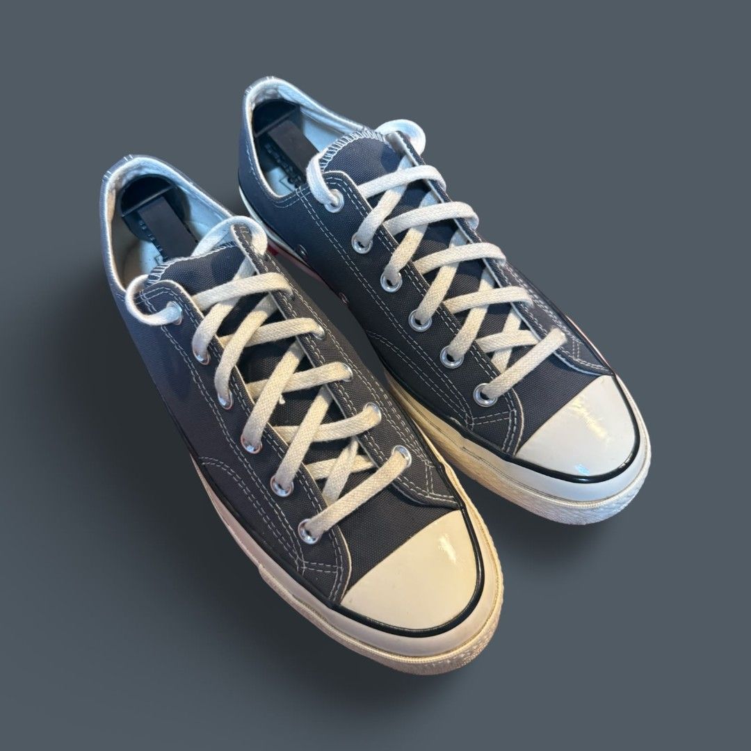 Converse Chuck 70 Low Dark Grey (Category: Casual Shoes) located in Del Monte. Submitted by jasonjuan31 (Listing ID 1466498069, Image 1). Description: - Brand: Converse Chuck 70 Low Top - Color: Dark grey canvas with contrast stitching and cream laces - Details: Classic white rubber toe caps, glossy foxing tape, metal eyelets, and black heel license plate - Condition: Well-maintained, always kept with shoe trees to preserve shape - Style: Versati