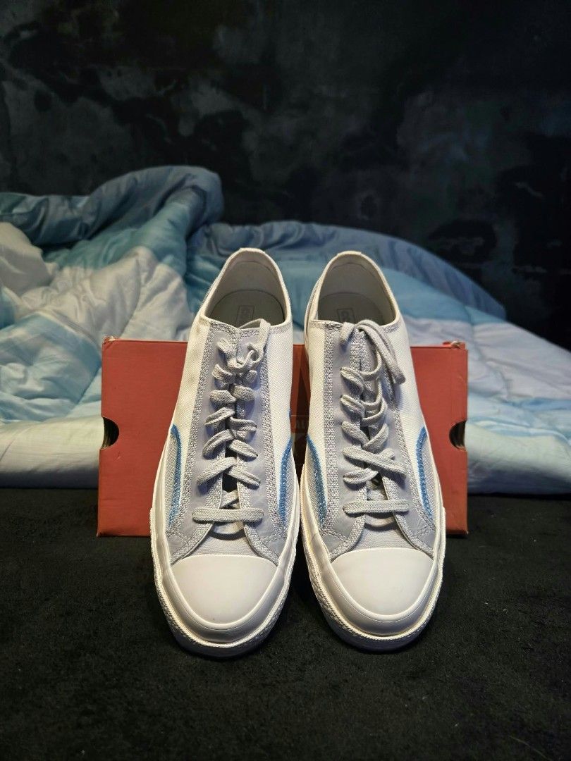 Converse Chuck 70 Low Grey White Blue (Category: Sneakers) located in Indang. Submitted by yoowhann (Listing ID 1466385914, Image 3). Description: - Brand: Converse - Style: Low-top sneakers - Color: Grey and white with light blue contrast stitching - Features: Rubber toe cap, flat laces, textured midsoles - Condition: Clean uppers and pristine outsoles - Packaging: Original orange shoe box included.