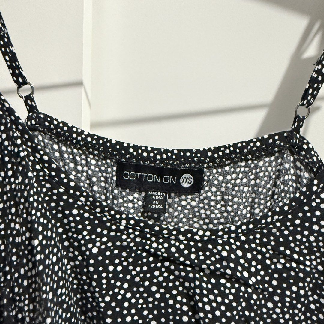 Cotton On Black & White Sundress (Category: Dresses) located in Pasay City. Submitted by kaikylestrinkets (Listing ID 1466494987, Image 2). Description: ✿ Cotton On ✿ XXS (fits XXS-S) ✿ Black with white polkadots ✿ In good condition, just needs ironing ✿ Has a ruffled design on the chest part with adjustable straps and garterized waistband.