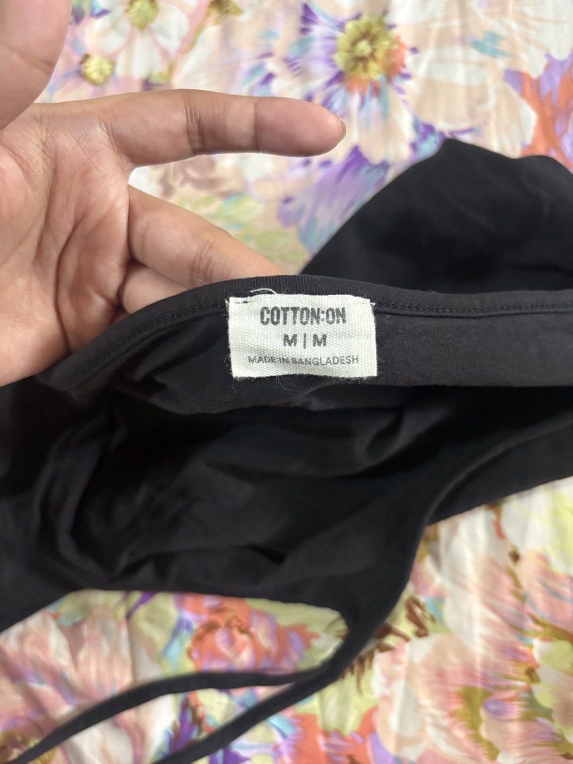 Cotton On Black Off-Shoulder Halter Top Size M (Category: Sleeveless) located in Paranaque City. Submitted by delikaite (Listing ID 1466415157, Image 2). Description: - Brand: Cotton On - Size: M (Made in Bangladesh) - Color: Black - Material: Cotton with good stretch - Design: Halter neck strap with cold-shoulder cutouts.