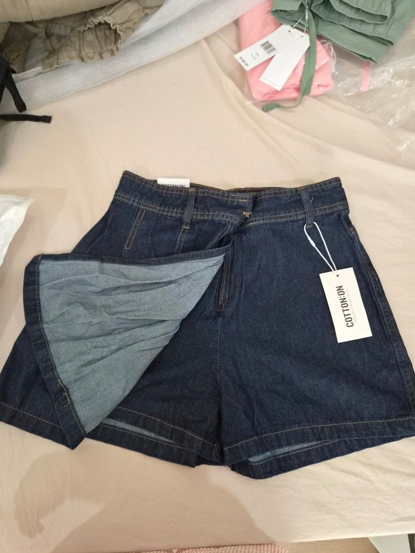 Cotton On Denim Skort Shorts (Category: Shorts) located in Taytay. Submitted by passiveincome89 (Listing ID 1466454818, Image 2). Description: - Brand: Cotton On - Condition: Brand new with tags (BNWT) - Color: Dark blue denim - Size: Fits up 27-29inches - Fit: Regular waist with belt loops - Details: Functional back pockets.