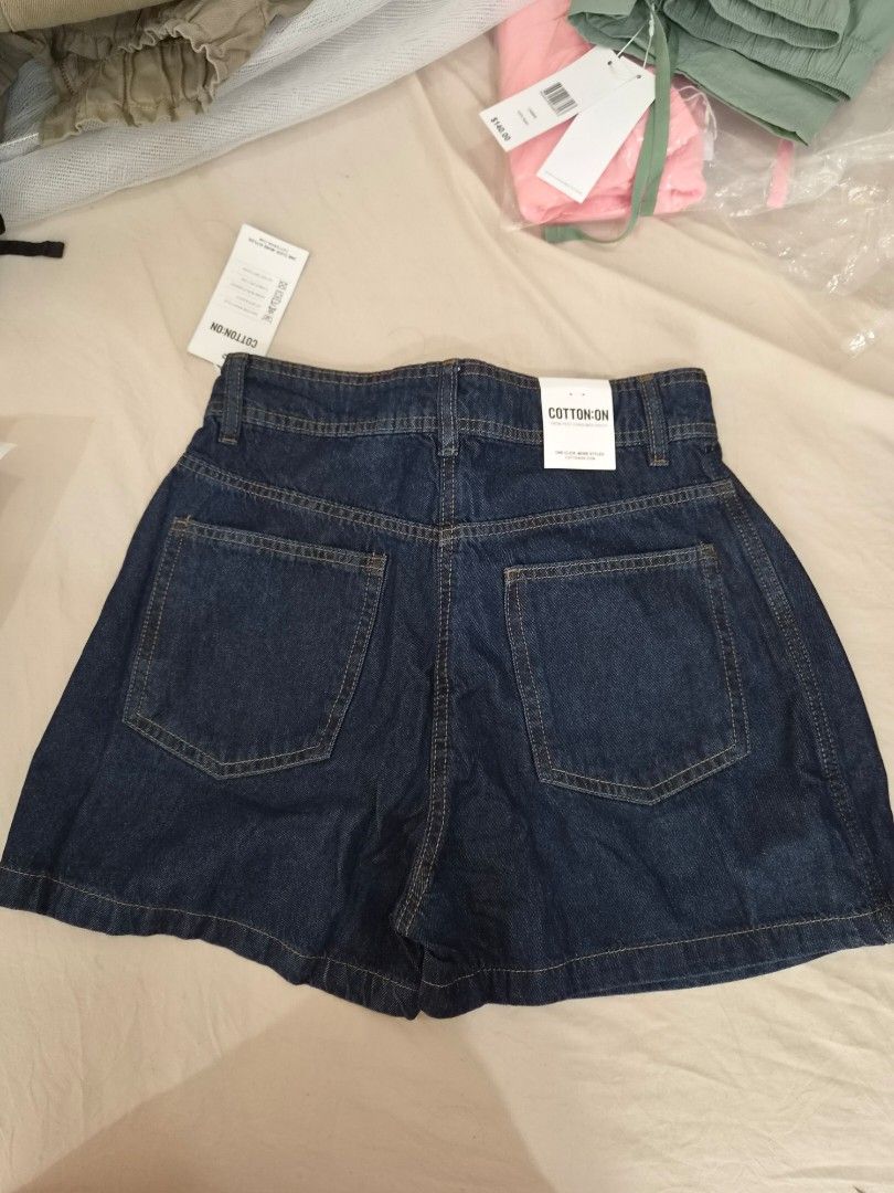 Cotton On Denim Skort Shorts (Category: Shorts) located in Taytay. Submitted by passiveincome89 (Listing ID 1466454818, Image 3). Description: - Brand: Cotton On - Condition: Brand new with tags (BNWT) - Color: Dark blue denim - Size: Fits up 27-29inches - Fit: Regular waist with belt loops - Details: Functional back pockets.