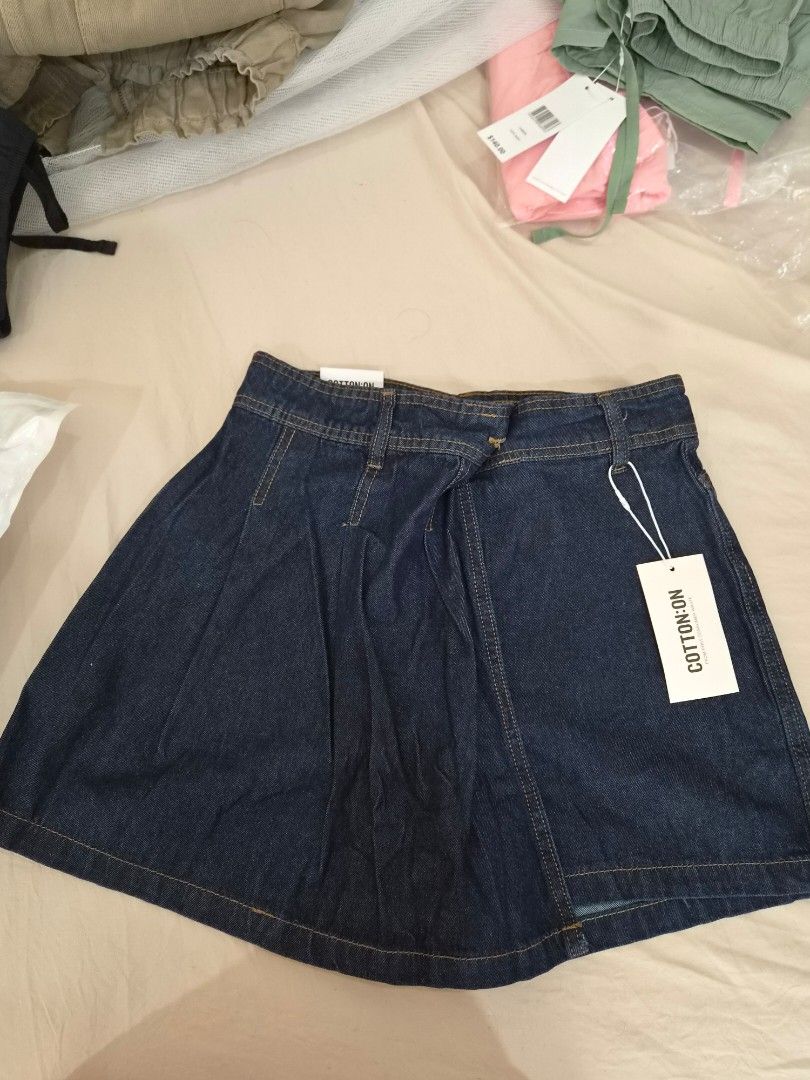 Cotton On Denim Skort Shorts (Category: Shorts) located in Taytay. Submitted by passiveincome89 (Listing ID 1466454818, Image 1). Description: - Brand: Cotton On - Condition: Brand new with tags (BNWT) - Color: Dark blue denim - Size: Fits up 27-29inches - Fit: Regular waist with belt loops - Details: Functional back pockets.