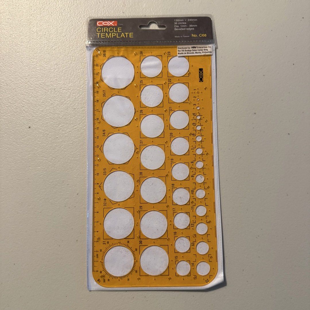 Cox Circle Template No. C68 (Category: Craft Supplies & Tools) located in Manila. Submitted by cheemkenn (Listing ID 1466413679, Image 1). Description: - Brand: Cox - Model: C68 Circle Template Tool - Condition: Brand new, still sealed in original packaging - Dimensions: 130mm x 240mm - Features: 36 circles with diameters from 1mm to 36mm - Design: Beveled edges for precise drawing made of clear yellow plastic.