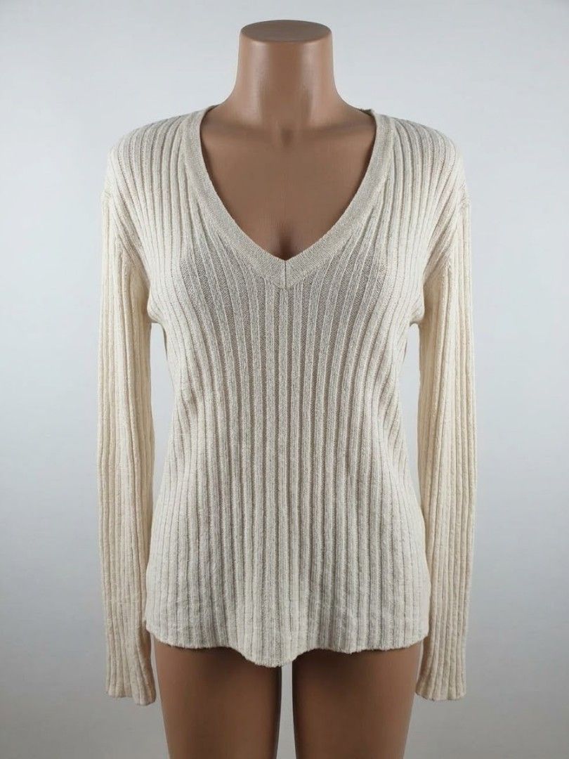 Cream Ribbed V-Neck Mesh Long Sleeve (Category: Longsleeves) located in Manila. Submitted by relaxlang (Listing ID 1466391732, Image 1). Description: - Color: Cream - Style: Long sleeve pullover with deep V-neckline - Texture: Vertical ribbed knit throughout body and sleeves - Material: Lightweight and easy to layer - Versatility: Neutral shade that pairs well with denim or skirts.