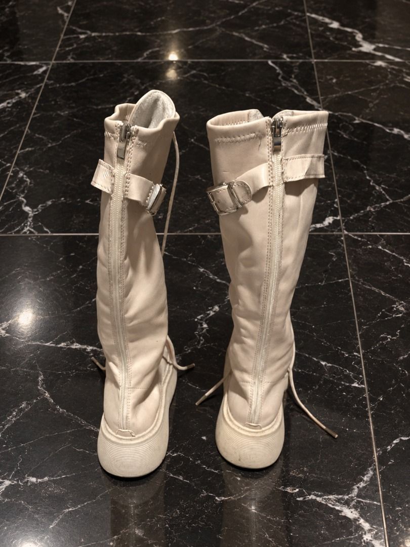 [SOLD] Cream/White Knee-High Platform Boots | Size 5–6 / 35–36 (Category: Boots) located in Manila. Submitted by sakki.ph (Listing ID 1466526623, Image 2). Description: Size: 5–6 | 35–36 • Knee-high lace-up platform boots • Has adjustable strap + buckle detail Condition: Preloved / With flaws (check photos) please manage expectations • Flaws: strap has peeling/cracking on the surface near the buckle (see 5th photo) • There are also visible crease