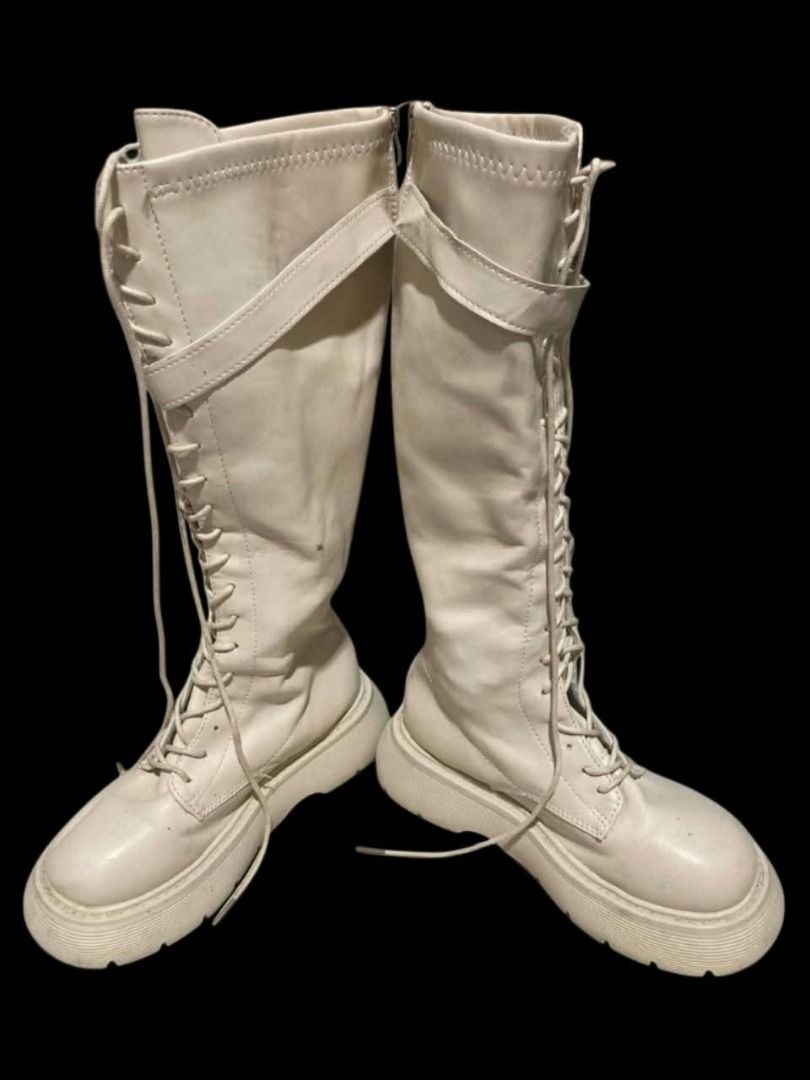 [SOLD] Cream/White Knee-High Platform Boots | Size 5–6 / 35–36 (Category: Boots) located in Manila. Submitted by sakki.ph (Listing ID 1466526623, Image 3). Description: Size: 5–6 | 35–36 • Knee-high lace-up platform boots • Has adjustable strap + buckle detail Condition: Preloved / With flaws (check photos) please manage expectations • Flaws: strap has peeling/cracking on the surface near the buckle (see 5th photo) • There are also visible crease