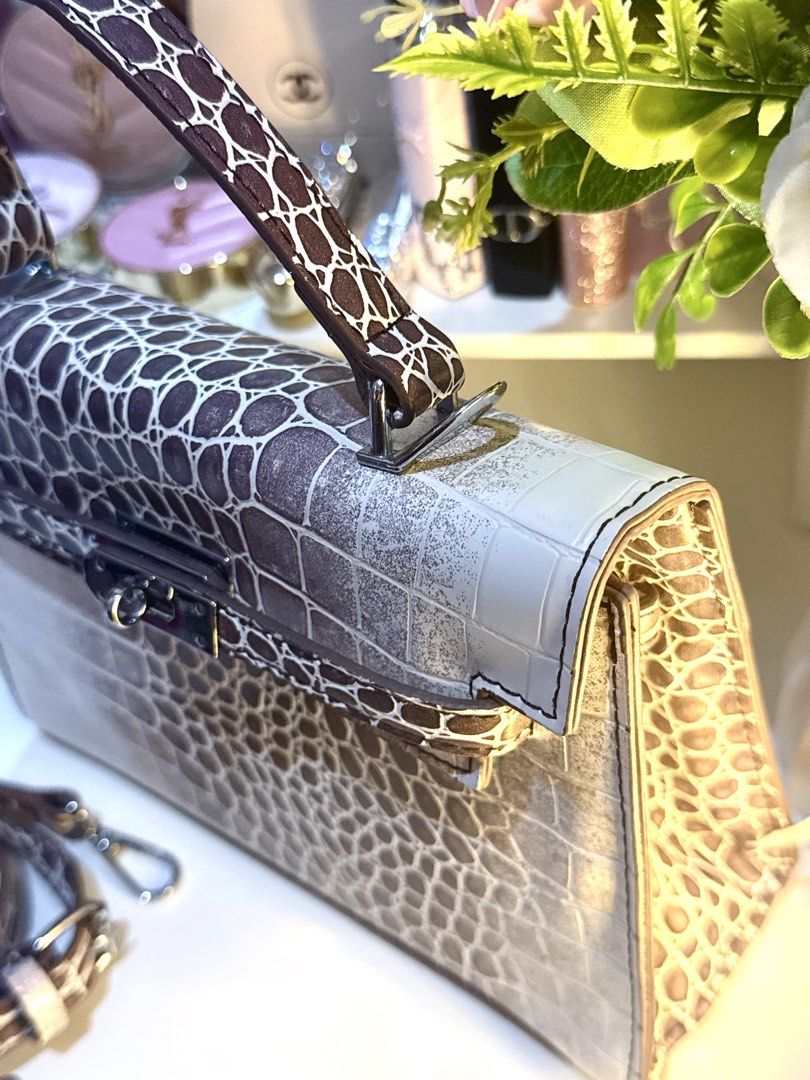 Crocodile Pattern Top Handle Bag With Strap (Category: Tote Bags) located in Bacoor. Submitted by micsr (Listing ID 1466447517, Image 3). Description: Inspired bag only brandnew Gradient faux crocodile pattern handbag in white and brown tones. Structured top handle design with a turn-lock closure. Includes a matching adjustable shoulder strap. Clean interior lining with slip pockets. Silver-tone hardware throughout..
