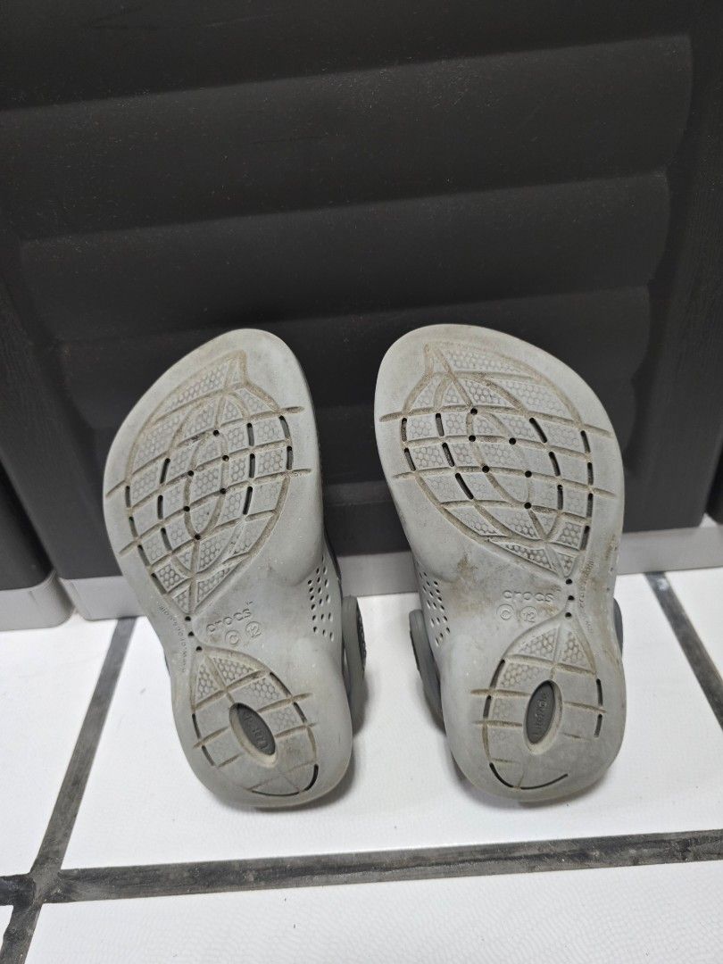Crocs LiteRide Clogs Grey Black c12 (Category: Babies & Kids Fashion) located in Naga. Submitted by flynm (Listing ID 1466351716, Image 3). Description: - Authentic Crocs LiteRide Clogs for age 4 - Color: Dark Grey and Black - Condition: Pre-owned with light wear on the bottom tread - RFS: outgrown.