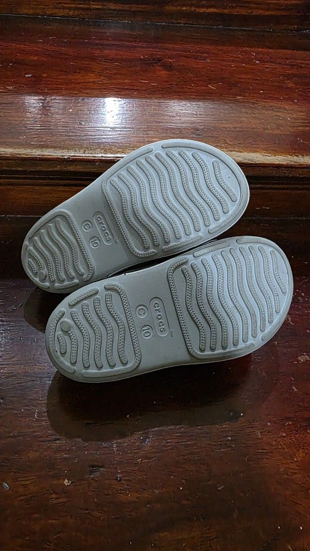 Crocs Toddler C10 Shark Sandals Grey (Category: Babies & Kids Fashion) located in Valenzuela. Submitted by bella_onez (Listing ID 1466445976, Image 3). Description: - Size: Toddler C10 - Color: Grey - Fun shark design along the midsole with a detachable shark Jibbitz charm - Dual strap closure for an easy, adjustable fit - Textured footbed for better grip and safety - Ideal for playground adventures or beach days - Trusted seller, fast shipping a
