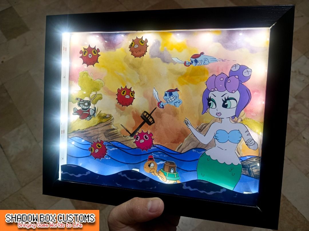 Cuphead vs Cala Maria Video Game Shadow Box (Category: Nintendo) located in Quezon City. Submitted by natzuki10 (Listing ID 1466358604, Image 2). Description: Cuphead vs Cala Maria Video Game Shadow Box Height: 8 inches Width: 10 inches 750 w/o lights 920 w/ lights *Handmade Pixel Shadow Boxes *Accepting Customized Designs *Perfect for Gamers & Collectors #videogames #playstation #nintendo #roomdecor #collection #gamer #gift.