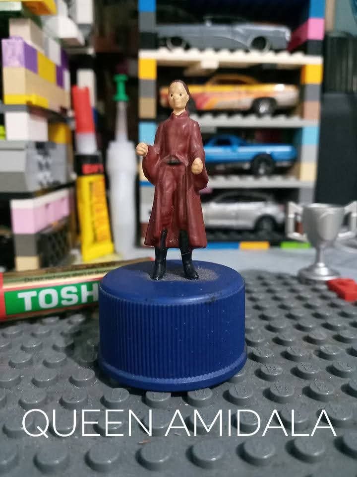 Custom Star Wars Miniature Figures Set (Category: Figurines & Statues) located in Manila. Submitted by angkalakal70797 (Listing ID 1466420213, Image 2). Description: - Hand-painted Star Wars mini figurines set - Mounted uniquely on blue bottle caps - 5-character lot includes: Scout Trooper, Queen Amidala, Luke Skywalker, Watto, and Lama Su - Highly detailed paintwork on every piece - Great for desks, shelves, dioramas, and toy displays - Perfect 