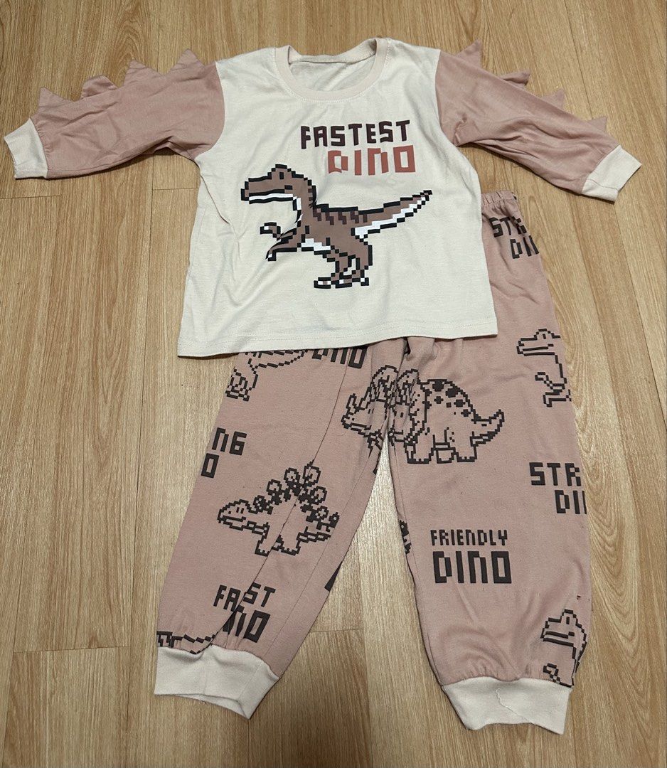 Cute Dinosaur Pixel Print Toddler Pajama Set (Category: Babies & Kids Fashion) located in Antipolo. Submitted by jloom (Listing ID 1466540157, Image 1). Description: - 2T bought in SM dept - - Fit to my son that is 3yrs old, mahaba pa ung pajama sa 3ft height.
