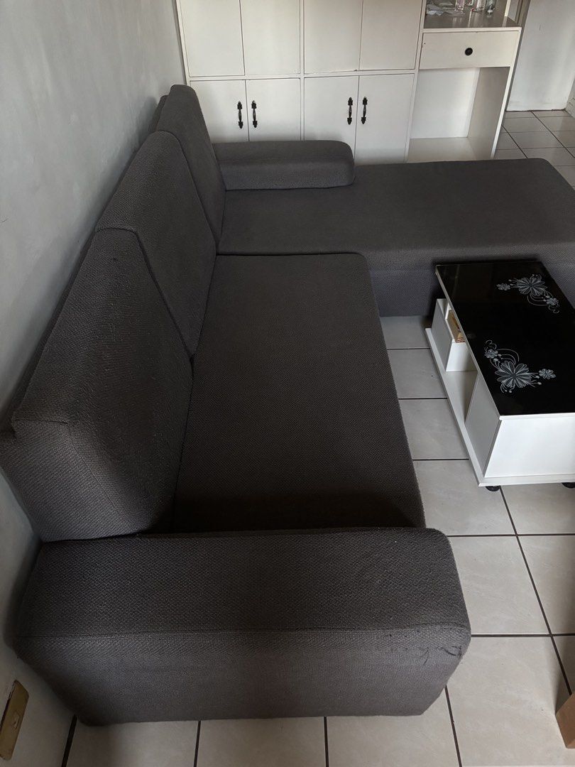 Dark Grey L-Shaped Sectional Sofa (Category: Sofas) located in Manila. Submitted by m1kkoo (Listing ID 1466344520, Image 2). Description: - Color: Dark grey - Type: Sectional sofa with chaise lounge - Material: Comfortable textured upholstery - Design: Clean lines with sturdy armrests - Logistics: Pickup only.