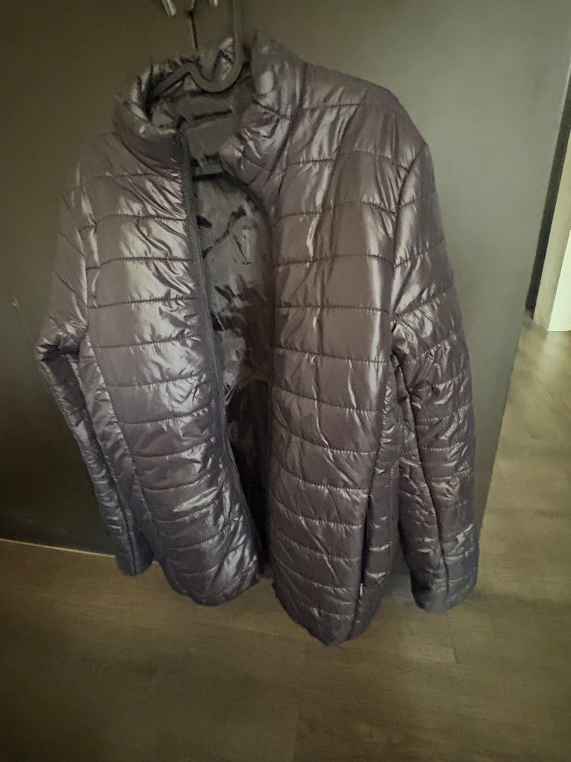Dark Grey Puffer Jacket (Category: Coats, Jackets and Outerwear) located in Las Pinas. Submitted by beissmart (Listing ID 1466364810, Image 3). Description: - Color: Dark grey - Style: Lightweight puffer jacket with full zip and high collar - Design: Horizontal quilted pattern for warmth - Condition: Clean, no obvious flaws - Best for: Chilly weather or easy layering.