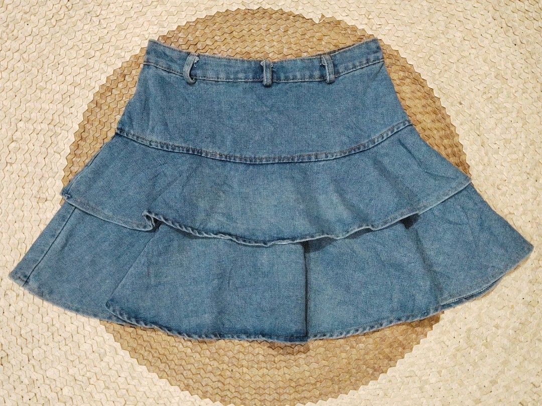 Denim tiered ruffle mini skirt (Category: Skirts) located in San Juan City. Submitted by rhennx (Listing ID 1466539379, Image 2). Description: 📌Size: 26 📌 Length: 15 📌No inner 📌Need wash ‼️Please note that the actual color may slightly vary due to lighting and screen settings. Deliver via lalamove or J&T (SF shoulder by the buyer) Payment first; Cash/Gcash/Bank Transfer .