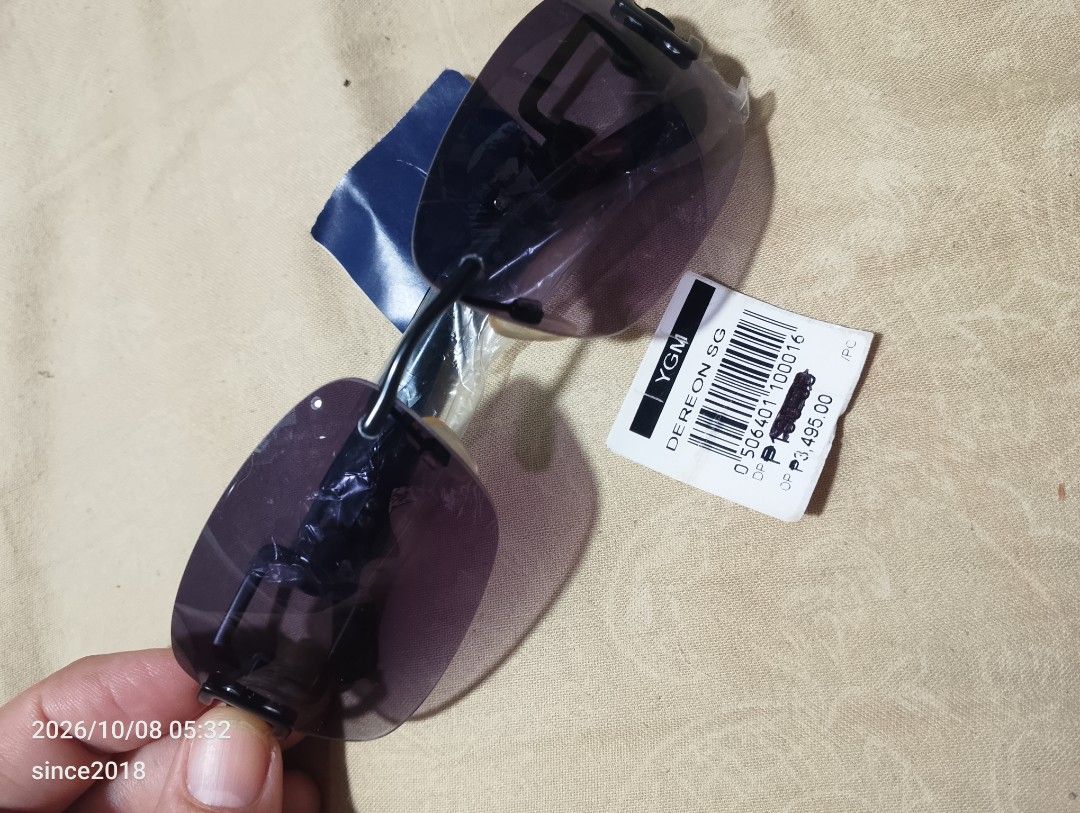 Dereon Eyewear APH553 001 Sunglasses (Category: Sunglasses & Eyewear) located in Quezon City. Submitted by sellingwithlove2018 (Listing ID 1466561397, Image 1). Description: - Brand: Dereon SG - Model: APH553 001 - Color/Style: Black frame with stylish purple gradient tinted lenses - Design: Rimless lower frame with geometric cutout detailing on the temple arms - Condition: Brand new, never worn, straight out of the store(ideal vision) - Inclusio