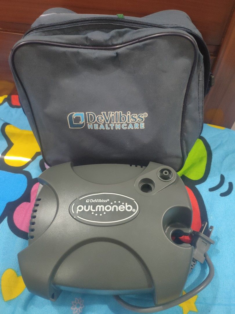 DeVilbiss PulmoNeb Compressor Nebulizer with Carry Bag (Category: Medical Supplies & Tools) located in Tayug. Submitted by quennyscollection (Listing ID 1466370164, Image 3). Description: - Authentic DeVilbiss PulmoNeb compressor nebulizer system (Model 3655PX) - Color: Durable gray plastic body - Power specs: 230V, 1.5A, 60Hz with standard two-prong plug - Easy-to-use side rocker switch near ventilation slots - Includes original matching gray De