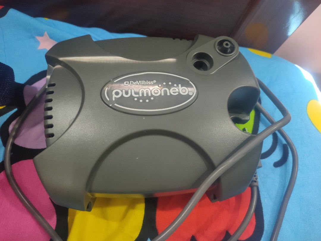 DeVilbiss PulmoNeb Compressor Nebulizer with Carry Bag (Category: Medical Supplies & Tools) located in Tayug. Submitted by quennyscollection (Listing ID 1466370164, Image 1). Description: - Authentic DeVilbiss PulmoNeb compressor nebulizer system (Model 3655PX) - Color: Durable gray plastic body - Power specs: 230V, 1.5A, 60Hz with standard two-prong plug - Easy-to-use side rocker switch near ventilation slots - Includes original matching gray De
