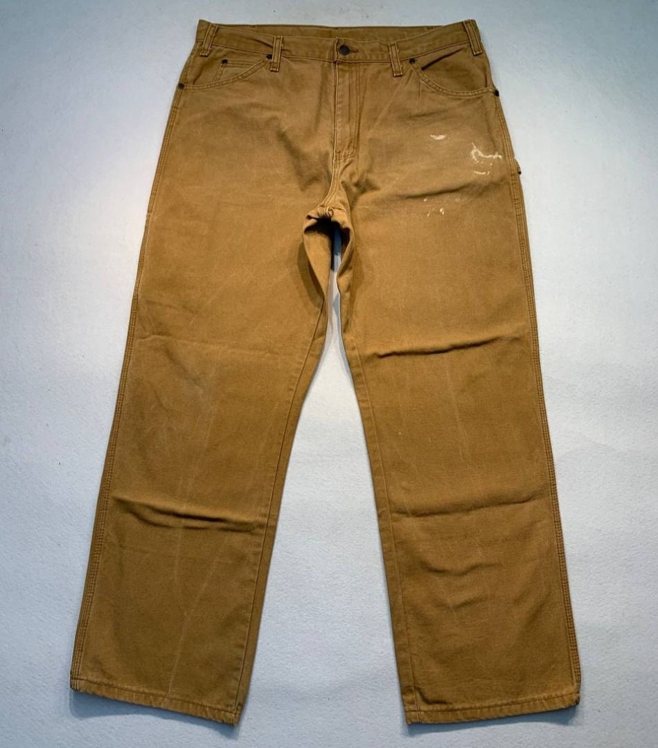 Dickies Brown Duck Canvas Work Pants (Category: Chinos) located in Mandaluyong City. Submitted by theroom501 (Listing ID 1466462034, Image 2). Description: Dickies Carpenter worker pants Style Code: Carps Size on Tag: 36 Color: Brown Condition: Good pre-owned condition with a heavily distressed vintage look. Flaws/Issues: paint stain and distressed Flat Lay Measurements: Pit to Pit: 36 inches Length: 41 inches Leegopening Length: 9 inches Price:2