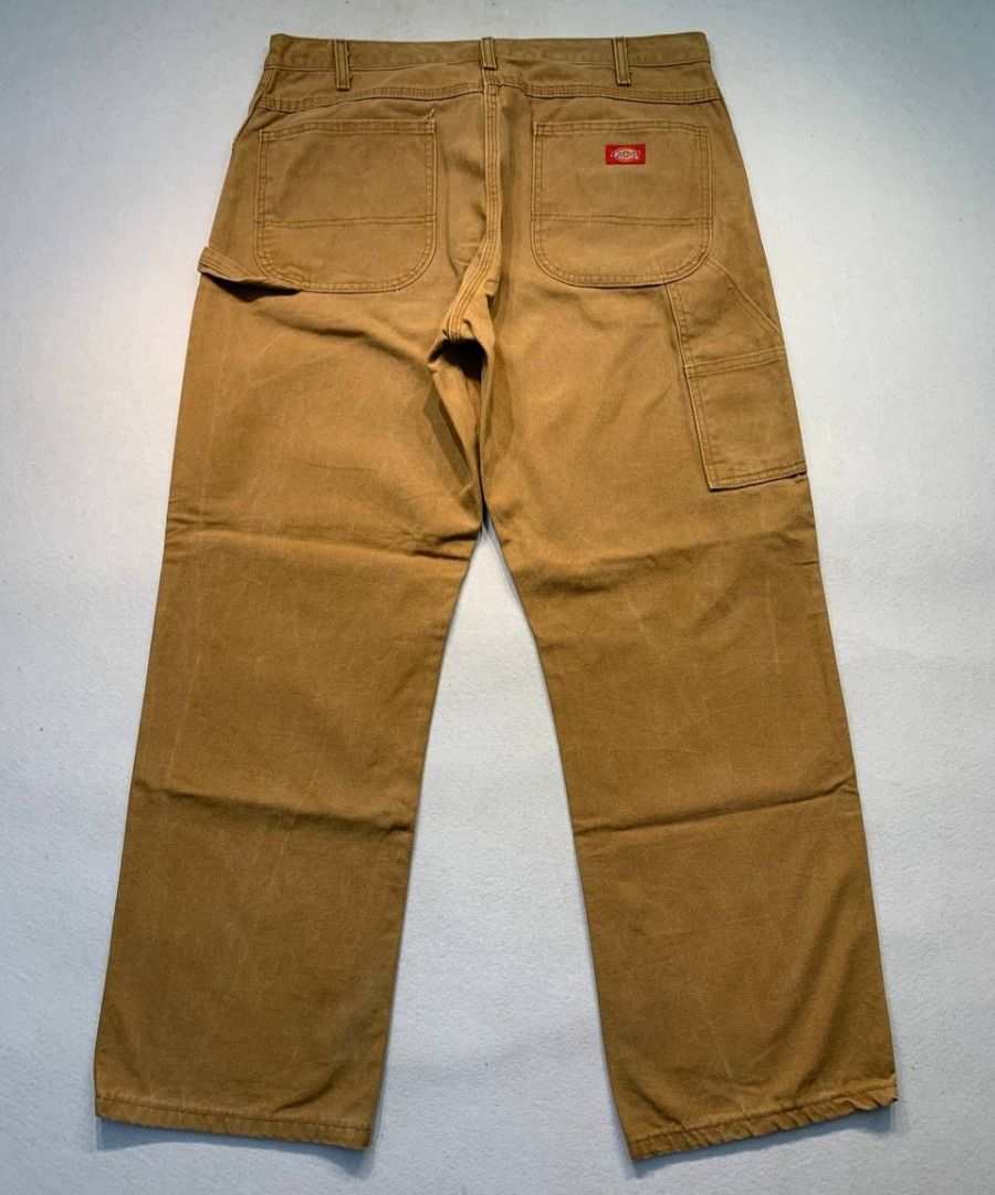 Dickies Brown Duck Canvas Work Pants (Category: Chinos) located in Mandaluyong City. Submitted by theroom501 (Listing ID 1466462034, Image 1). Description: Dickies Carpenter worker pants Style Code: Carps Size on Tag: 36 Color: Brown Condition: Good pre-owned condition with a heavily distressed vintage look. Flaws/Issues: paint stain and distressed Flat Lay Measurements: Pit to Pit: 36 inches Length: 41 inches Leegopening Length: 9 inches Price:2