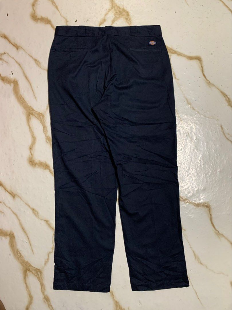 Dickies Navy Blue Work Pants (Category: Trousers) located in Iloilo. Submitted by johnpullan30303 (Listing ID 1466421294, Image 2). Description: - Brand: Dickies - Item: Navy Blue Work Pants - Size: XL - Condition: Clean inside and out, well-maintained - Features: Classic fit, sturdy fabric build, belt loops, secure button closure, and iconic Dickies logo patch on the back pocket - Versatility: Perfect for daily casual outfits, workwear rotation,