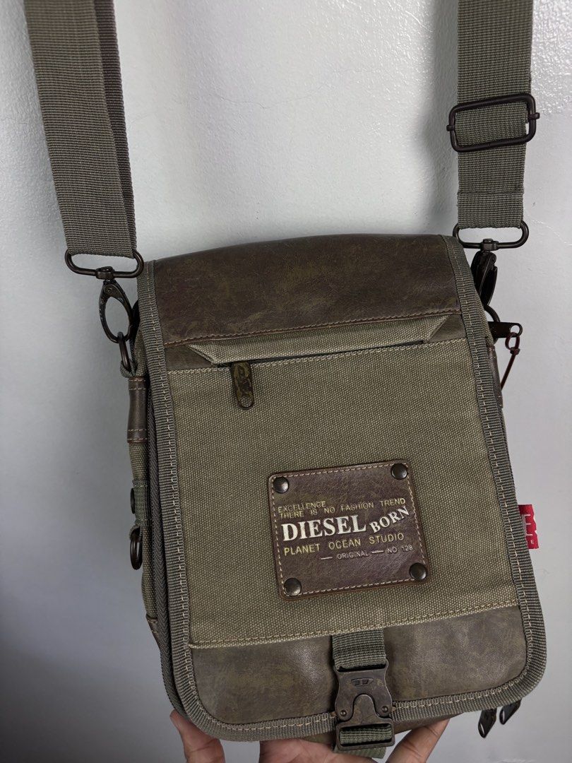 Diesel Canvas and Lesther Multi Pocket Sling Bag. (Category: Sling Bags) located in Bacoor. Submitted by jewa333 (Listing ID 1466407232, Image 2). Description: Diesel Canvas and Lesther Multi Pocket Sling Bag. Dimes: Height 11” Length 8.5” Depth 2” Excellent condition Issue: None. 🏷️1,500 only. 📥📥📥.