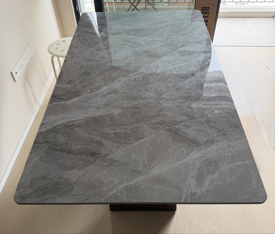 Dining table (Category: Tables & Sets) located in Singapore. Submitted by roselle77 (Listing ID 1466388027, Image 1). Description: Sintered stone dining table. Length 1.4m, depth 80cm, height 75cm Comes with a long wooden bench that sits 3-4 pax. Please arrange mover who can dismantle table.