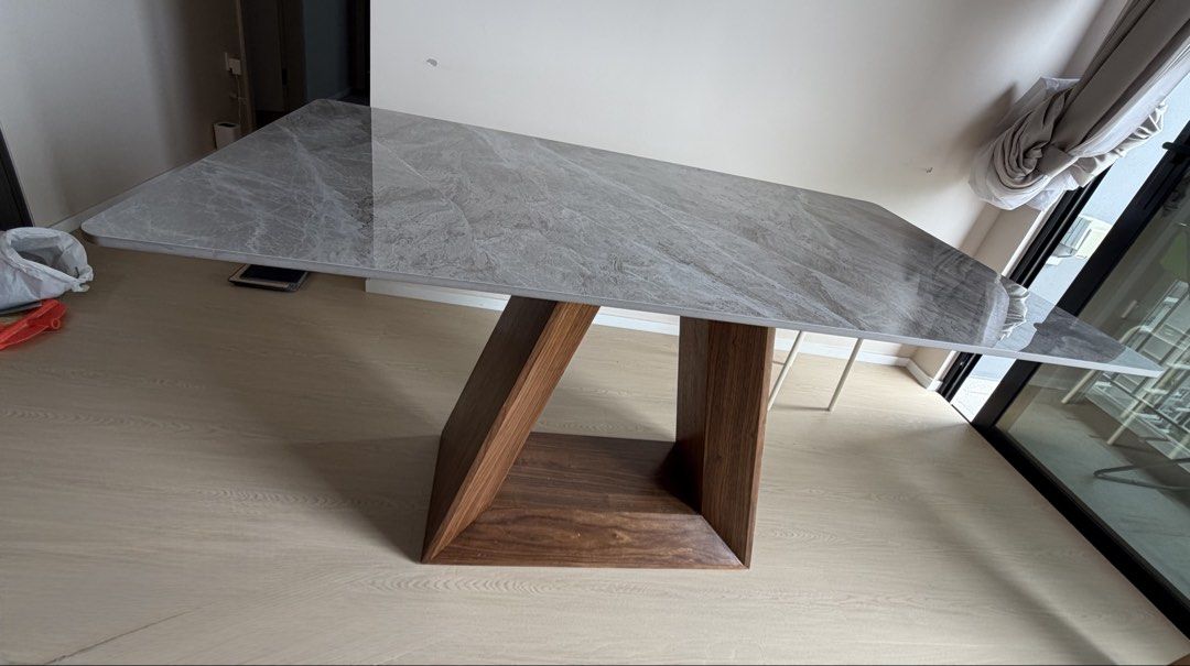 Dining table (Category: Tables & Sets) located in Singapore. Submitted by roselle77 (Listing ID 1466388027, Image 2). Description: Sintered stone dining table. Length 1.4m, depth 80cm, height 75cm Comes with a long wooden bench that sits 3-4 pax. Please arrange mover who can dismantle table.