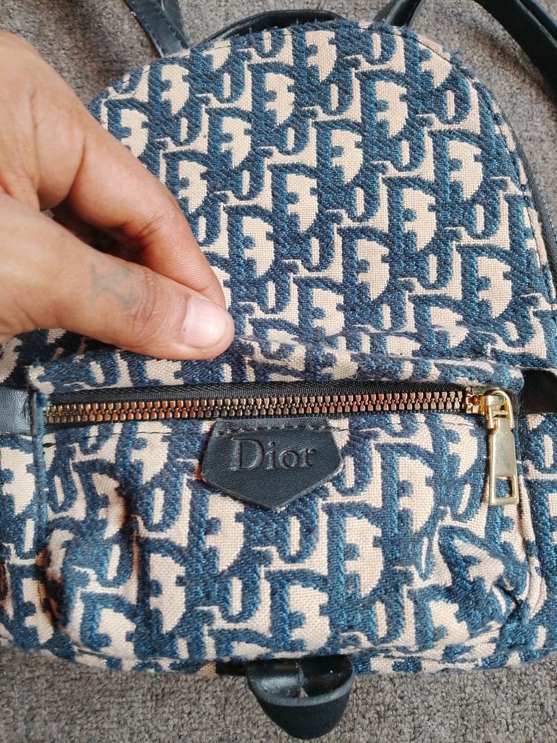 DIOR MINI BACKPACK (Category: Backpacks) located in Manila. Submitted by secondarygarments (Listing ID 1466384458, Image 3). Description: DIOR MINI BACKPACK DETAILS: - 10 inches Height - 8 Inches Width - 4 Inches Thickness - Width Adjustable Slings - Issue: Sign of usage only - 10/10 Colorrate - Excellent Condition - .