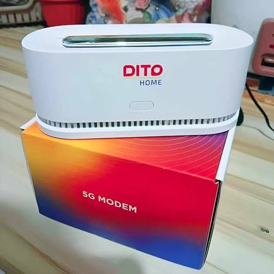 DITO Home 5G Modem Router (Category: Networking) located in Makati City. Submitted by smith_1 (Listing ID 1466417798, Image 2). Description: - Model: DITO Home 5G Modem Router (White) - Speed: Up to 500 Mbps for ultra-fast home internet - Design: Sleek oval shape with distinct red and blue logo - Condition: network setup.