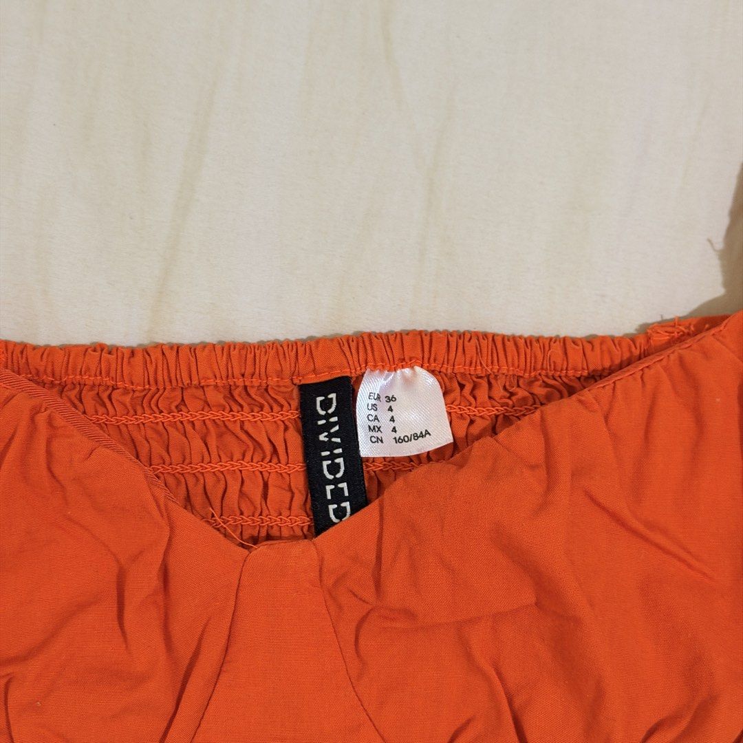 Divided Orange Corset Style Crop Top (S) (Category: Sleeveless) located in Guinobatan. Submitted by ktonkatsu (Listing ID 1466360740, Image 2). Description: 📍BICOL Shipping via J&T - Brand: Divided - Size: EUR 36 / US 4 (CN 160/84A) - Color: Vibrant bright orange - Style: Crop top with square neckline, short puff sleeves, and curved hem - Details: Corset-style bodice with shaped cups and smocked back - Material: Lightweight cotton blend, ideal f