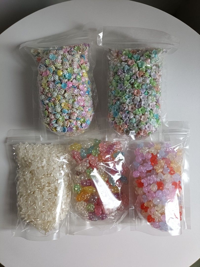 DIY Craft Beads Assorted Shapes and Colors (Category: Craft Supplies & Tools) located in Tanza. Submitted by misumei (Listing ID 1466362819, Image 1). Description: Jelly Bunny Big Hole & Side Hole - approx. 220g bell flower - approx. 320g flower caps - approx. 320g pearl butterfly - approx. 180g luminous cloud - approx. 190g.