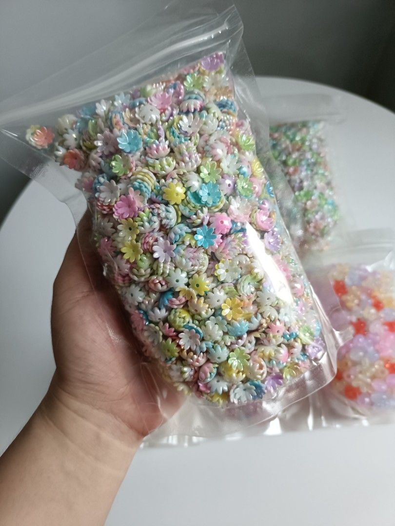 DIY Craft Beads Assorted Shapes and Colors (Category: Craft Supplies & Tools) located in Tanza. Submitted by misumei (Listing ID 1466362819, Image 2). Description: Jelly Bunny Big Hole & Side Hole - approx. 220g bell flower - approx. 320g flower caps - approx. 320g pearl butterfly - approx. 180g luminous cloud - approx. 190g.