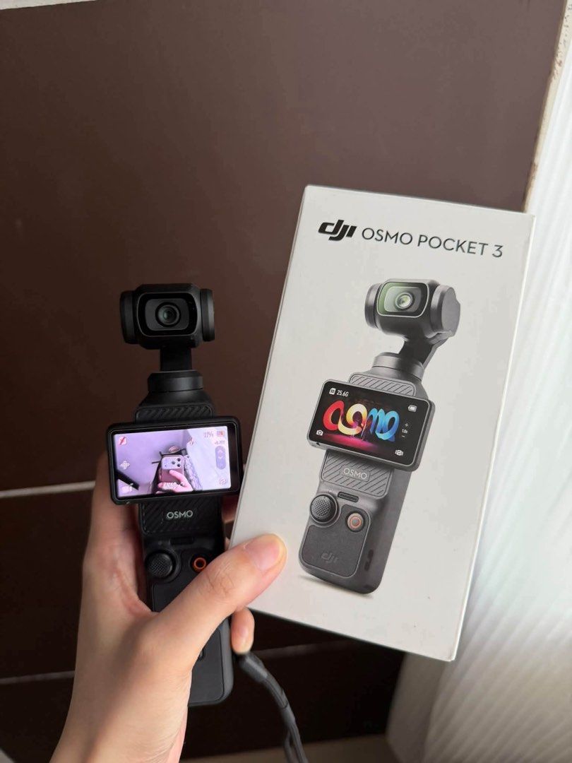 DJI Osmo Pocket 3 Gimbal Camera (Category: Cameras) located in Quezon City. Submitted by rencizuniga (Listing ID 1466358692, Image 1). Description: - Model: DJI Osmo Pocket 3 (Black) - Condition: Fully functional, clean glass and screen - Key Features: Compact 4K camera, rotating touchscreen, 3-axis mechanical gimbal stabilization - Ideal For: Vlogging and travel videography - Inclusions: Original retail box and wrist strap attached to handle PRI
