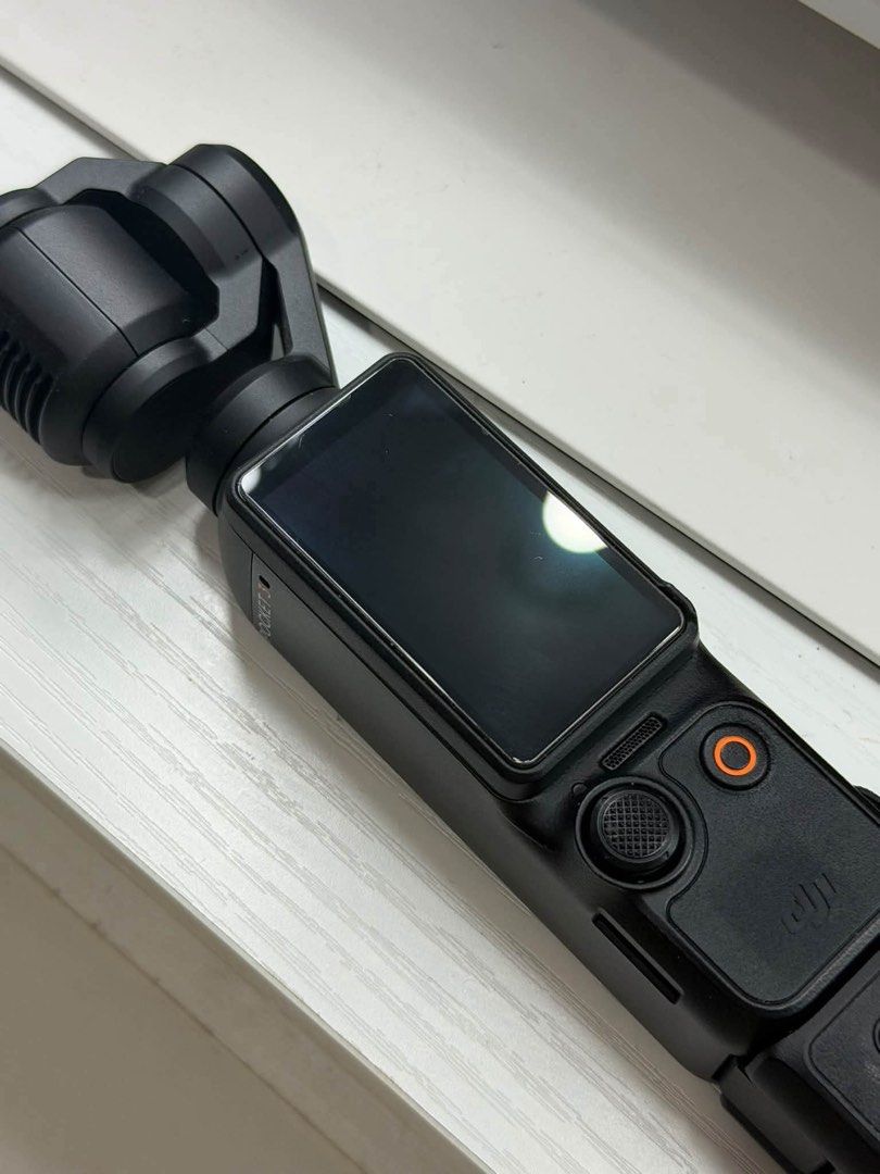 DJI Osmo Pocket 3 Gimbal Camera (Category: Cameras) located in Quezon City. Submitted by rencizuniga (Listing ID 1466358692, Image 2). Description: - Model: DJI Osmo Pocket 3 (Black) - Condition: Fully functional, clean glass and screen - Key Features: Compact 4K camera, rotating touchscreen, 3-axis mechanical gimbal stabilization - Ideal For: Vlogging and travel videography - Inclusions: Original retail box and wrist strap attached to handle PRI