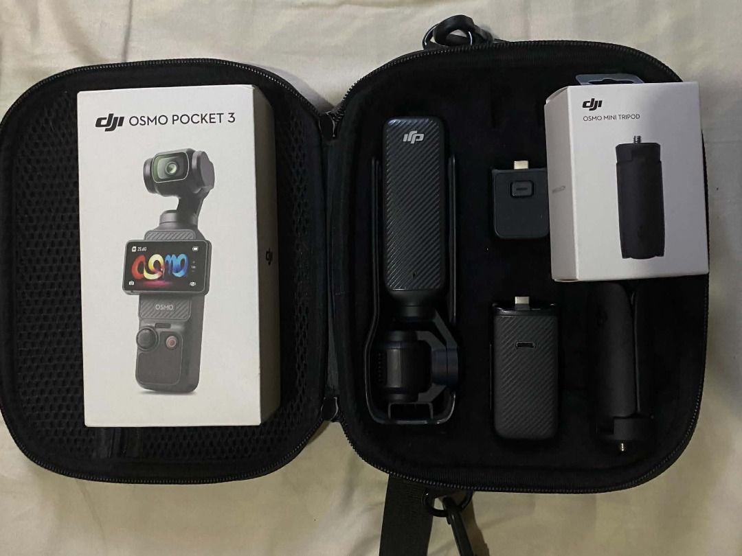 DJI Osmo Pocket 3 (Plus Accessories) for Sale (Category: Cameras) located in Caloocan City. Submitted by archangyl (Listing ID 1466443685, Image 2). Description: Condition: Like-new Inclusions: DJI Tripod/ Grip DJI Battery Handle 64GB Sandisk SD Card Box and Case Key Specifications: • Sensor & Lens: 1-inch CMOS sensor with a 20mm equivalent f/2.0 lens. • Video Resolution: Up to 4K at 120fps for slow-motion, and standard 4K at up to 60fps. • Displ