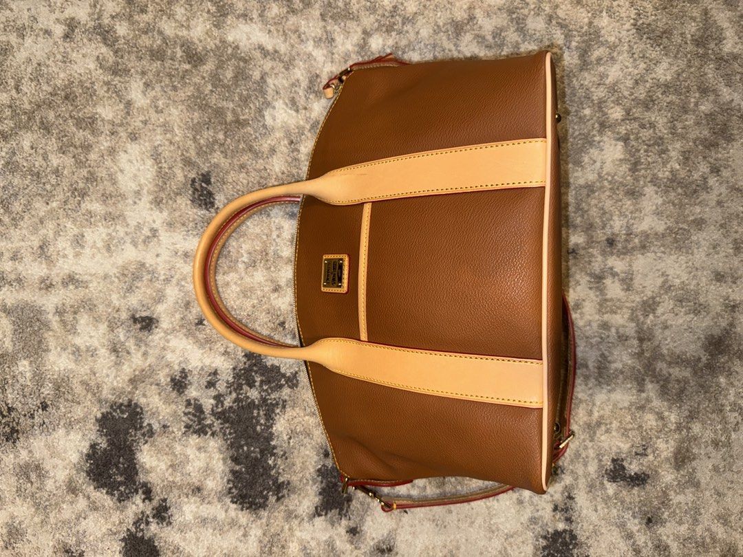 Dooney & Bourke Madeline Satchel Peanut Brittle (Category: Luxury Bags & Wallets) located in Quezon City. Submitted by czarinathehuman9 (Listing ID 1466456176, Image 2). Description: - Brand: Dooney & Bourke - Madeline Satchel in Peanut Brittle NEVER USED BRAND NEW.