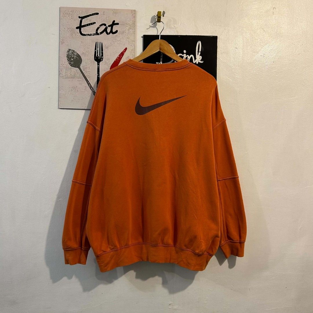 Double Small Swosh Crewneck Sweater (Category: Coats, Jackets and Outerwear) located in Quezon City. Submitted by streetwearandluxph (Listing ID 1466558917, Image 2). Description: Double Small Swosh Crewneck Sweater 1500 for both black and orange.