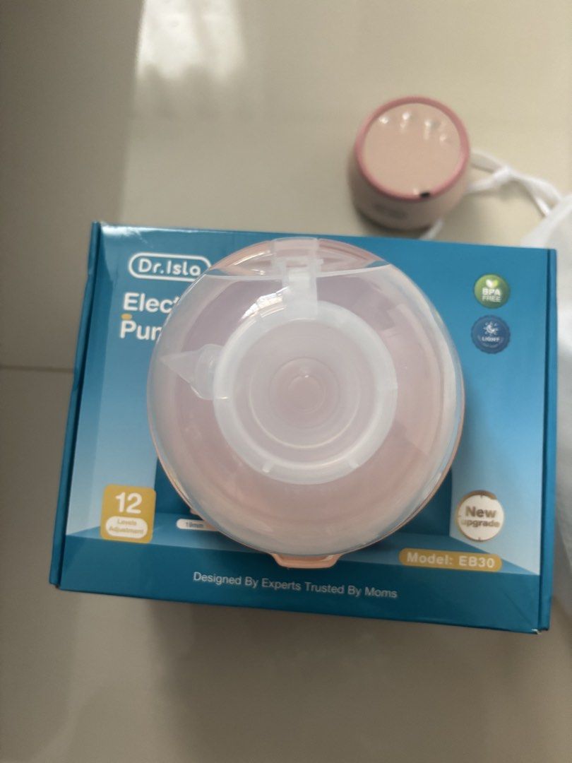 Dr. Isla Electric Breast Pump Model EB-30 (Category: Breastfeeding & Bottle Feeding) located in Quezon City. Submitted by prelovedbykg_ (Listing ID 1466430508, Image 2). Description: - Brand: Dr. Isla - Model: EB-30 (Pink) - Condition: Like new with original box - Features: Touch display, adjustable suction levels, and rear battery indicator light - Design: Portable and lightweight for convenient on-the-go pumping - Inclusions: Main pump motor, c