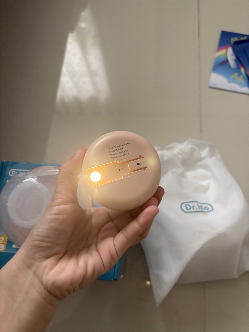 Dr. Isla Electric Breast Pump Model EB-30 (Category: Breastfeeding & Bottle Feeding) located in Quezon City. Submitted by prelovedbykg_ (Listing ID 1466430508, Image 3). Description: - Brand: Dr. Isla - Model: EB-30 (Pink) - Condition: Like new with original box - Features: Touch display, adjustable suction levels, and rear battery indicator light - Design: Portable and lightweight for convenient on-the-go pumping - Inclusions: Main pump motor, c