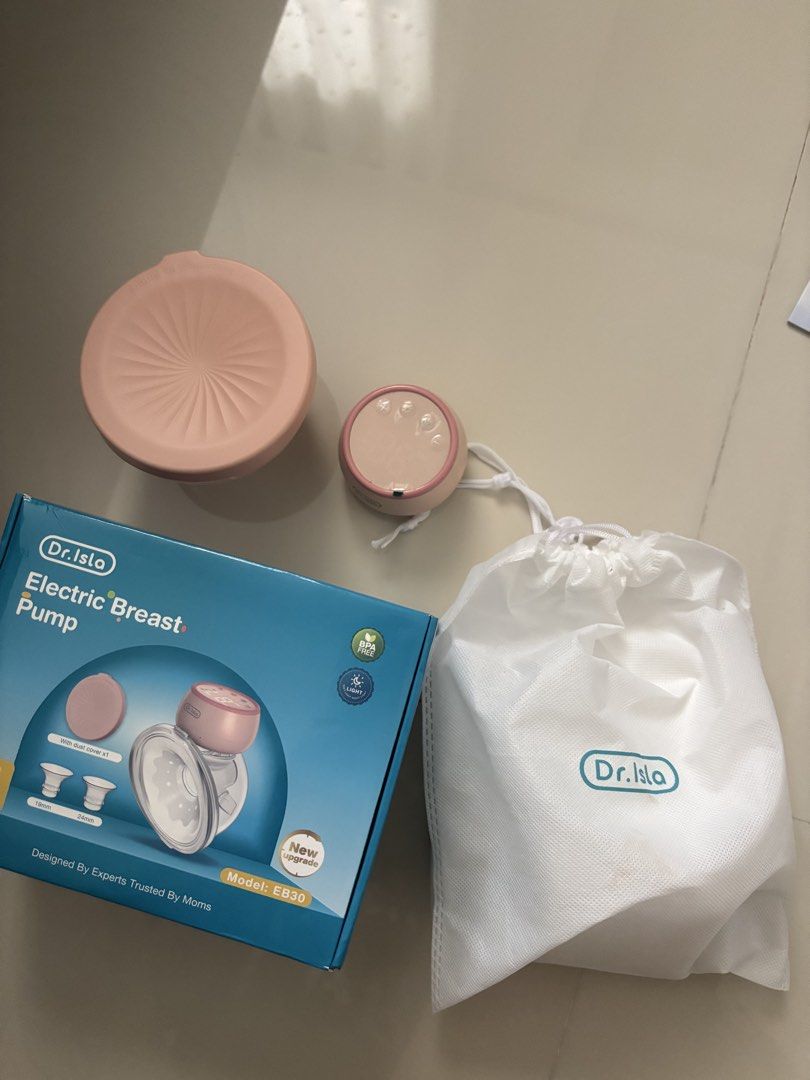Dr. Isla Electric Breast Pump Model EB-30 (Category: Breastfeeding & Bottle Feeding) located in Quezon City. Submitted by prelovedbykg_ (Listing ID 1466430508, Image 1). Description: - Brand: Dr. Isla - Model: EB-30 (Pink) - Condition: Like new with original box - Features: Touch display, adjustable suction levels, and rear battery indicator light - Design: Portable and lightweight for convenient on-the-go pumping - Inclusions: Main pump motor, c