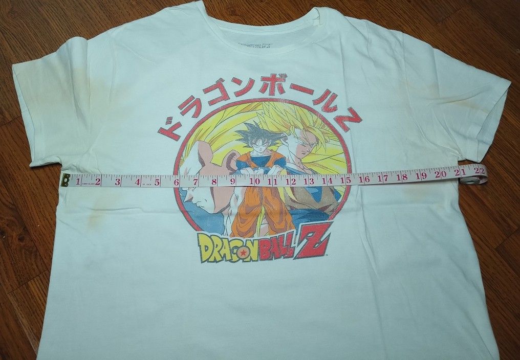 Dragon Ball Z White Graphic Tee Size L (Category: Tshirts & Polo Shirts ) located in Manila. Submitted by patrickjos06722 (Listing ID 1466525682, Image 3). Description: - Item: Dragon Ball Z Graphic Tee - Design: Goku & Vegeta with Japanese text - Color: White - Material: 100% Cotton (Made in Mexico) - Size: Large (Pit to pit: ~21", Length: ~26") - Condition: Pre-owned with notable yellow stains under the arms and on both sleeves (please check ph