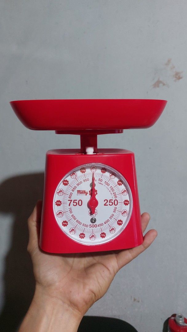 Dretec x Milky Analog Kitchen Scale 1kg (Category: Health Monitors & Weighing Scales) located in Santa Cruz. Submitted by tovybonacruz (Listing ID 1466401921, Image 2). Description: - Brand: Fujiya Milky Collaboration - Item: Red analog kitchen scale - Capacity: Up to 1kg - Design: Classic mechanical style with adorable candy graphics on the dial - Includes: Removable weighing bowl and original packaging - Perfect for: Everyday baking, meal prep,