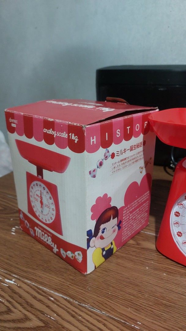 Dretec x Milky Analog Kitchen Scale 1kg (Category: Health Monitors & Weighing Scales) located in Santa Cruz. Submitted by tovybonacruz (Listing ID 1466401921, Image 3). Description: - Brand: Fujiya Milky Collaboration - Item: Red analog kitchen scale - Capacity: Up to 1kg - Design: Classic mechanical style with adorable candy graphics on the dial - Includes: Removable weighing bowl and original packaging - Perfect for: Everyday baking, meal prep,