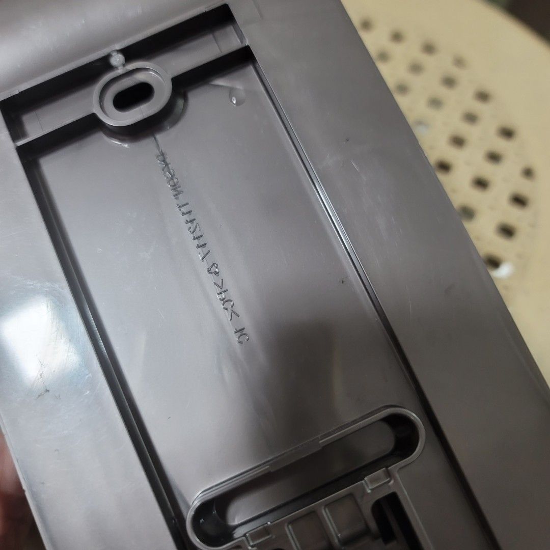 Dyson Charging Dock Wall Mount Station Bracket (Category: Vacuum Cleaner & Housekeeping) located in Pasig City. Submitted by bunny.bella (Listing ID 1466409960, Image 3). Description: - Genuine Dyson spare wall mount dock - Color: Grey - Features a dual charging slot area - Perfect replacement if your old dock broke or went missing - Condition: Good, but has a piece of double-sided tape stuck inside the base channel.
