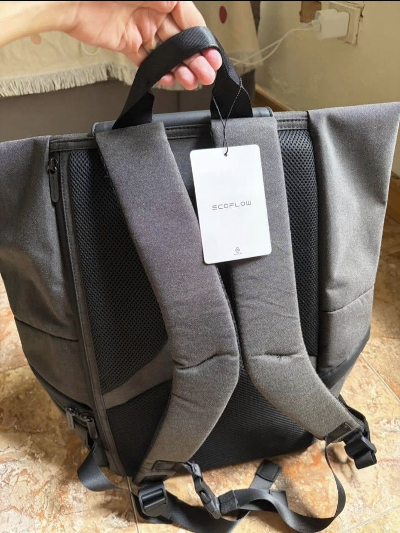 EcoFlow Power a New World Backpack (Category: Backpacks) located in Bacoor. Submitted by rachejan.gregorio.24 (Listing ID 1466383147, Image 3). Description: EcoFlow roll-top backpack in dark grey and black. Durable water-resistant material on the bottom compartment. Padded mesh shoulder straps with sternum strap and top grab handle. Main compartment expands with a roll-top closure secured by a buckle strap. Front zipped pocket and subtle branding