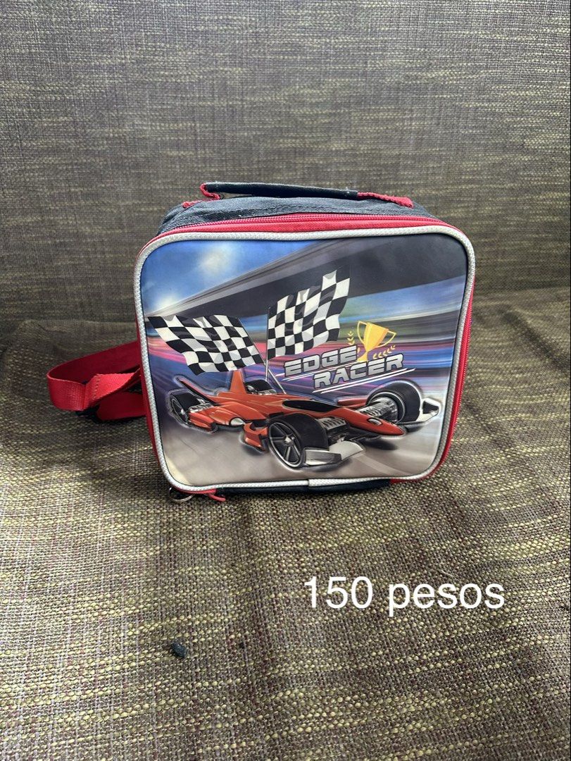 Edge Racer Kids Lunch Bag with Strap (Category: Tote Bags) located in Pasay City. Submitted by kimverlygo50697 (Listing ID 1466401001, Image 1). Description: - Edge Racer kids lunch bag with a sporty red and black racing car design - Equipped with a smooth-working zipper, top handle, and an adjustable red shoulder strap - White wipeable interior lining for easy cleaning - Features a built-in small elastic band inside to secure a bottle or utensil