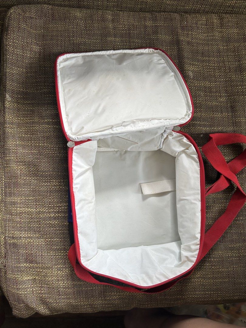Edge Racer Kids Lunch Bag with Strap (Category: Tote Bags) located in Pasay City. Submitted by kimverlygo50697 (Listing ID 1466401001, Image 3). Description: - Edge Racer kids lunch bag with a sporty red and black racing car design - Equipped with a smooth-working zipper, top handle, and an adjustable red shoulder strap - White wipeable interior lining for easy cleaning - Features a built-in small elastic band inside to secure a bottle or utensil